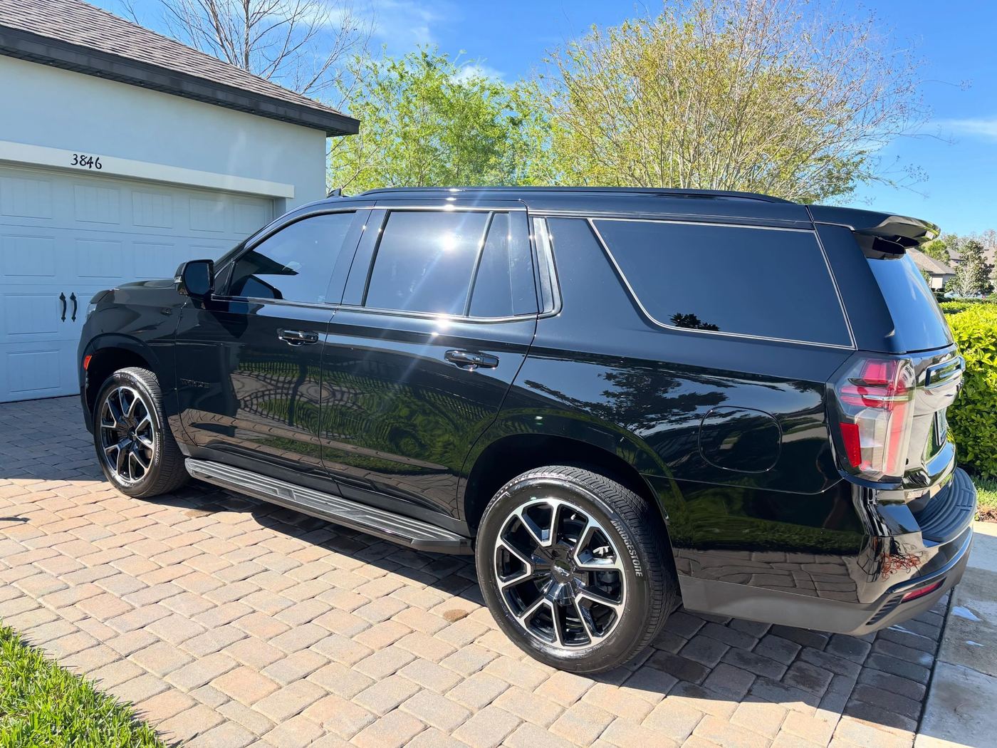 The same Tahoe after the Premier One detail — jet black, showroom finish