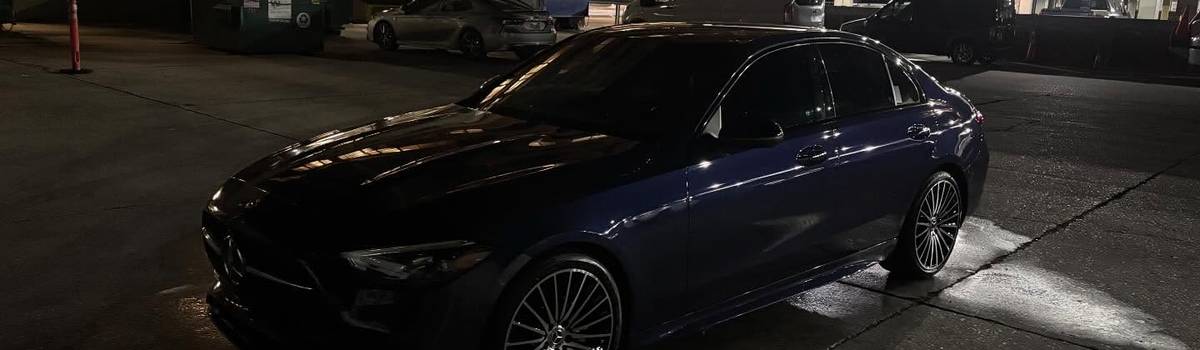 Dark BMW freshly detailed at night by Premier One