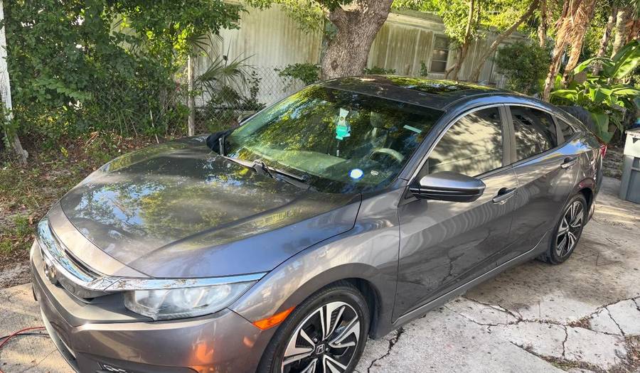 Gray Honda Civic washed and sealed by Premier One